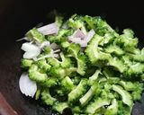 A picture of step 1 of PAVAKKA THEEYAL/KAYAPAKA PULI/BITTER GOURD CURRY.