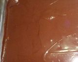 A picture of step 13 of Karidopita with pudding and chocolate glaze.