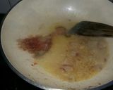 A picture of step 3 of Aaloo bangan with white rice.
