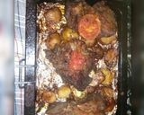 A picture of step 1 of Baked and roasted beef steaks some roast potatoes and tomatos.