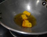 A picture of step 1 of Dhokla in gravy.