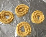 A picture of step 8 of Moong Dal Chakli.