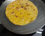 A picture of step 4 of Mango theplas with mango salsa.