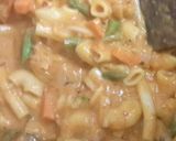 A picture of step 4 of Green and pink sauce backed pasta.