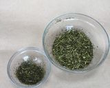 A picture of step 1 of Japanese green tea leaf - refreshed and revived again.
