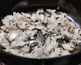 A picture of step 1 of Ghooguni (Spicy White peas curry).