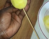 A picture of step 3 of Spiral potato and carrots on stick.