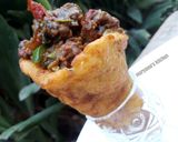 A picture of step 12 of Plantain stuffed cones.