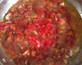 A picture of step 4 of Seafood Saganaki.