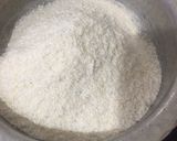 A picture of step 1 of Coconut ladoo.