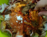 A picture of step 7 of Ragi mudda with mutton curry.