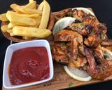 A picture of step 5 of Sweet and tangy bbq chicken wings.