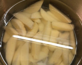 A picture of step 3 of Baked Spiced potato wedges with garlic Bechamel sauce.