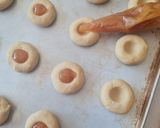 A picture of step 9 of Jam Thumbprint Cookies.