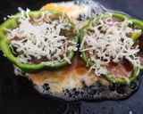 A picture of step 4 of Cheesy egg stuffed peppers.