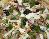 A picture of step 6 of Malai boti pizza with white sauce.