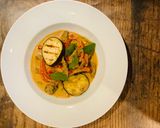 A picture of step 9 of Beef and grilled aubergine red curry topped with Bird eye chillis.