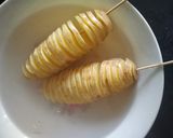 A picture of step 4 of Tornado Potatoes.
