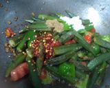 A picture of step 3 of Spicy schezwan bhindi.