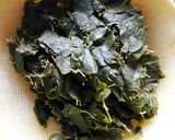 A picture of step 2 of Munagaaku Fry(Drumstick Leaves Fry).