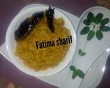 A picture of step 7 of Jallof rice with smoke fish.
