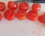 A picture of step 2 of Pomordorini e caprino cherry tomatoes stuffed with goat's cheese.