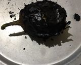 A picture of step 2 of Brinjal bharta.