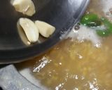 A picture of step 3 of Daal Chawal with fry Fish.