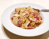 A picture of step 5 of Japanese style! Bacon and Mushroom pasta with butter and soy-sauce!.