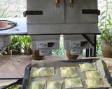 A picture of step 3 of Sweet potato with dhania and spinach and onion puff pastry's baked in the Cookswell jiko.