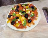 A picture of step 10 of Jain Cheese burst pizza.