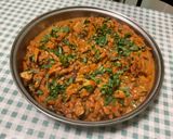 Une image de l'étape 29 de Poulet aux cacahuètes, carottes, tomates et épices.