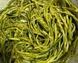 A picture of step 4 of Zucchini Spaghetti with Basil Pesto, Crumbled Feta, Almonds, and Pine Nuts.