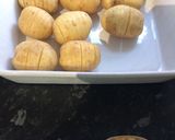 A picture of step 1 of Hassleback rosemary and garlic new potatoes.