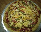 A picture of step 9 of Chicken pizza#festive contest Nairobi#authors marathon.