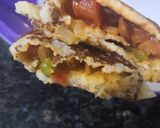 A picture of step 3 of Schezwan paneer dosa.