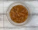 A picture of step 1 of Shiitake powder adds the Umami taste - fried rice noodles with plenty of chicken.