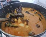 A picture of step 3 of Stuffed Brinjal potatoes in gravy.