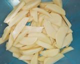 A picture of step 2 of Baked potato wedges.