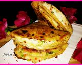 A picture of step 16 of Roti ke double layer tringle shape pizza.