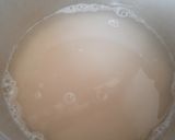 A picture of step 6 of Broken rice tomato bath.