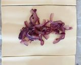 A picture of step 2 of Fluffy's sausage rolls with caramelised red onion.
