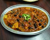 A picture of step 7 of Chana aalu masala.