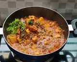 A picture of step 12 of Muttor paneer with laccha paratha.