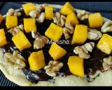 A picture of step 11 of Choco-Mango-Walnut Pizza.