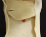 A picture of step 14 of 3 spice chicken filled bread.