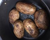 A picture of step 1 of Air Fryer Baked Potato Baked Garlic Parsley Potatoes.