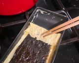 A picture of step 4 of Japanese seaweed tamagoyaki - rolled omelette.
