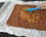A picture of step 12 of Snickers Chocolate Roll Cake.