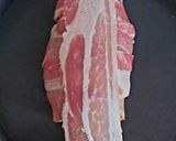 A picture of step 3 of Bacon Wrapped around Chicken breast with soft Smoked Cheese 🤩.